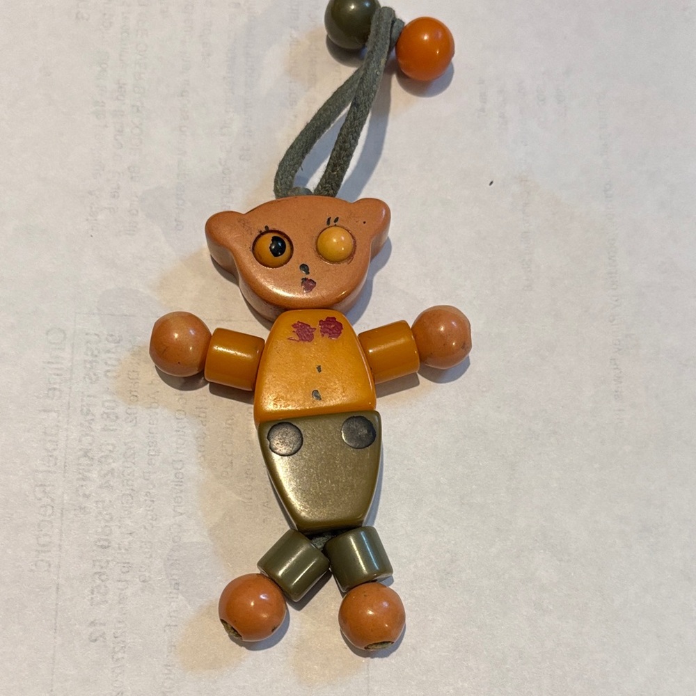Unique Vintage Orange and Green Bakelite crib toy, from 1930s Bear Brooch